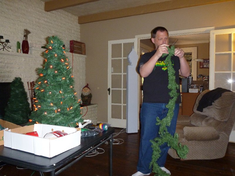 P1000169.JPG - John with his version of the mini-tree - a 2 hour discussion on garland zzzzzz