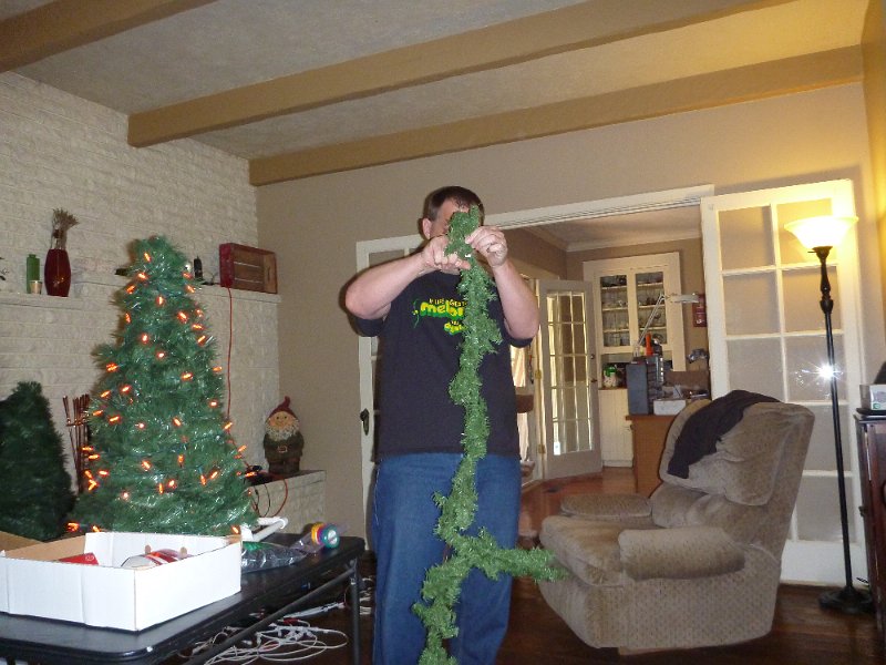 P1000170.JPG - John with his version of the mini-tree - a 2 hour discussion on garland zzzzzz