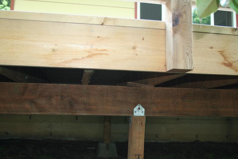 IMG_1743.JPG - Under side of deck shimmed. Correct lumber used?